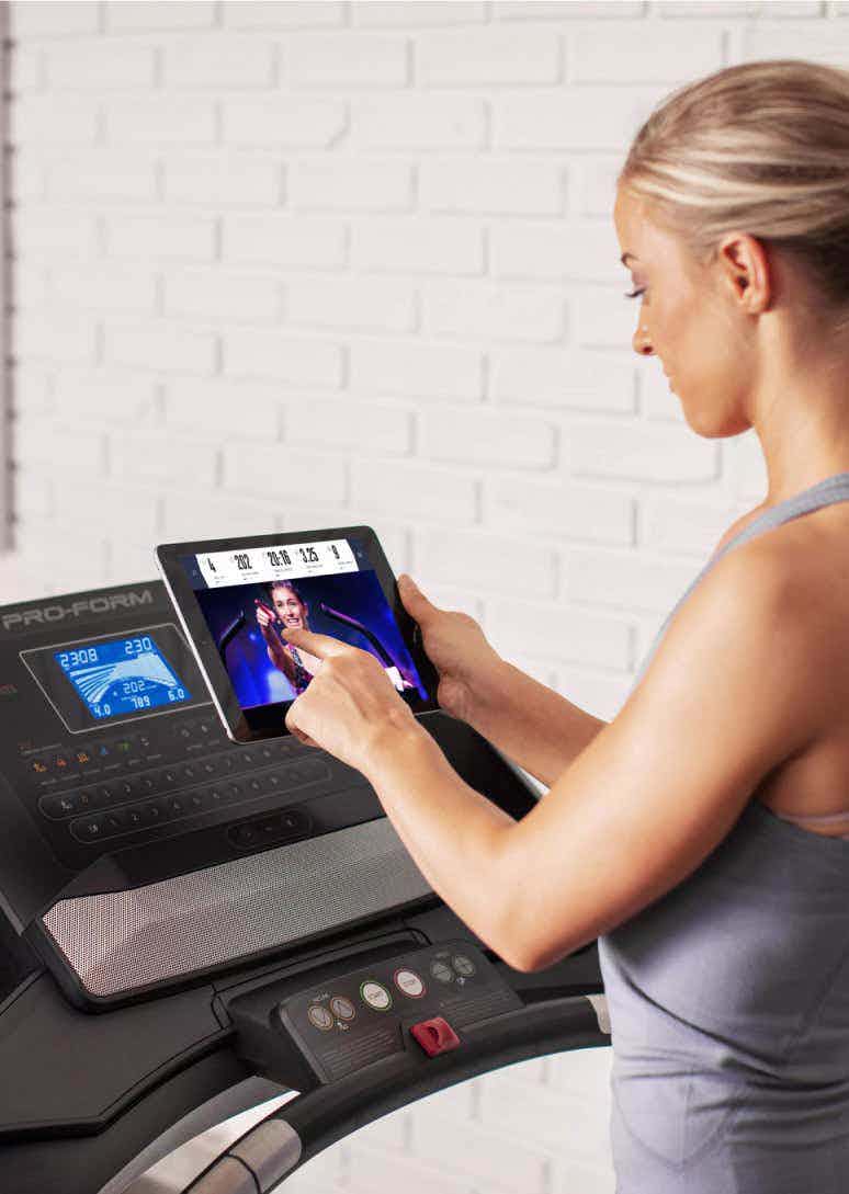 Woman uses iFIT on tablet