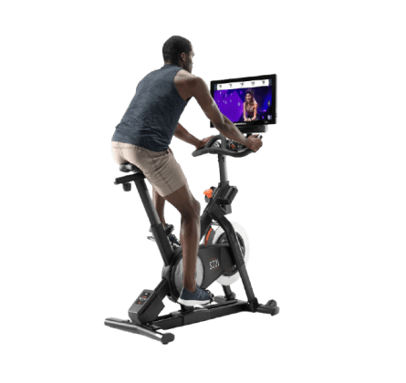 Man does a cycling workout on an iFIT-enabled bike