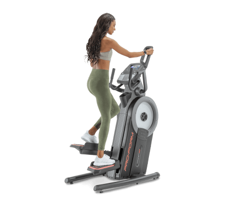 Woman does a cardio workout on an iFIT-enabled elliptical