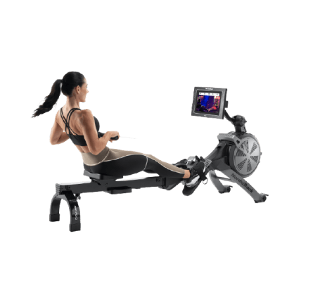 Woman does a rowing workout on an iFIT-enabled rower